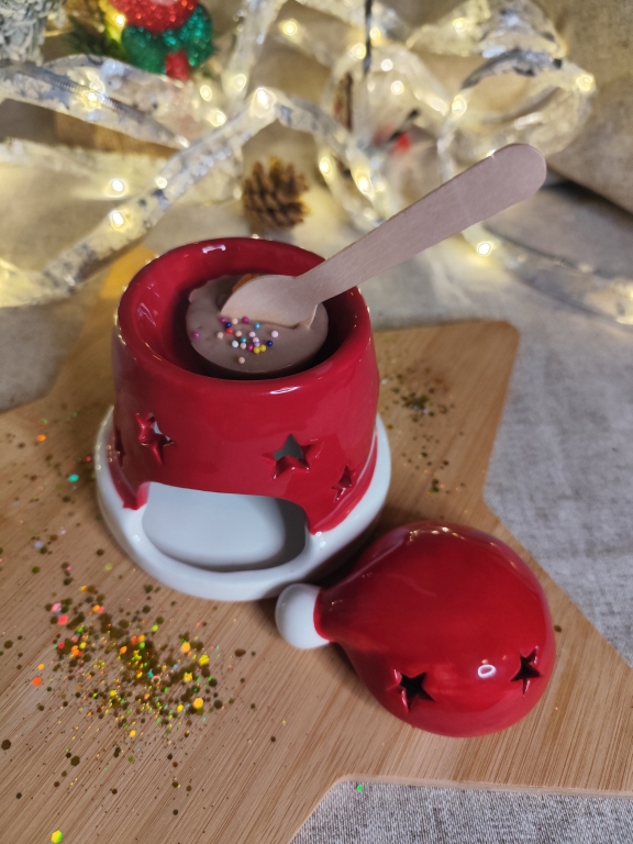 Brûleur bonnet de Noël avec un fondant parfumé en utilisation